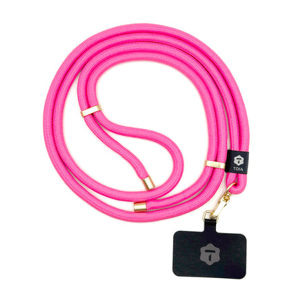 Modern hot pink crossbody phone lanyard with gold metal hardware by TOIA.