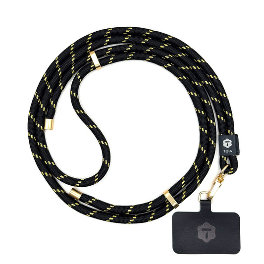Modern black and gold striped crossbody phone lanyard with gold metal hardware by TOIA.