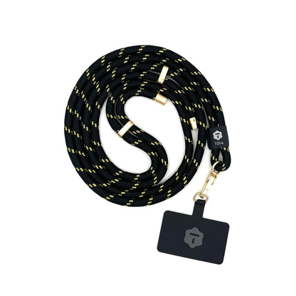 Modern black and gold crossbody phone lanyard with gold hardware by TOIA.