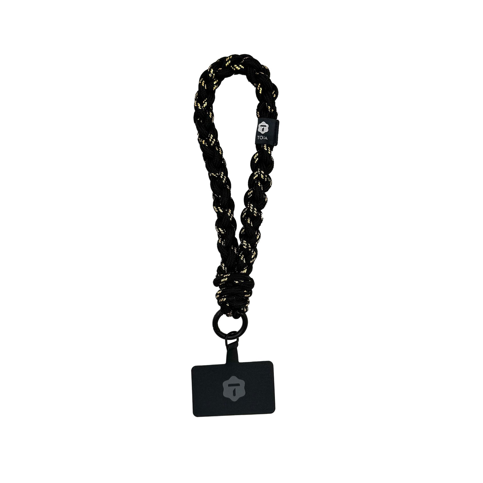 Braided black-and-gold wrist phone strap by TOIA featuring a woven texture and matte black clasp