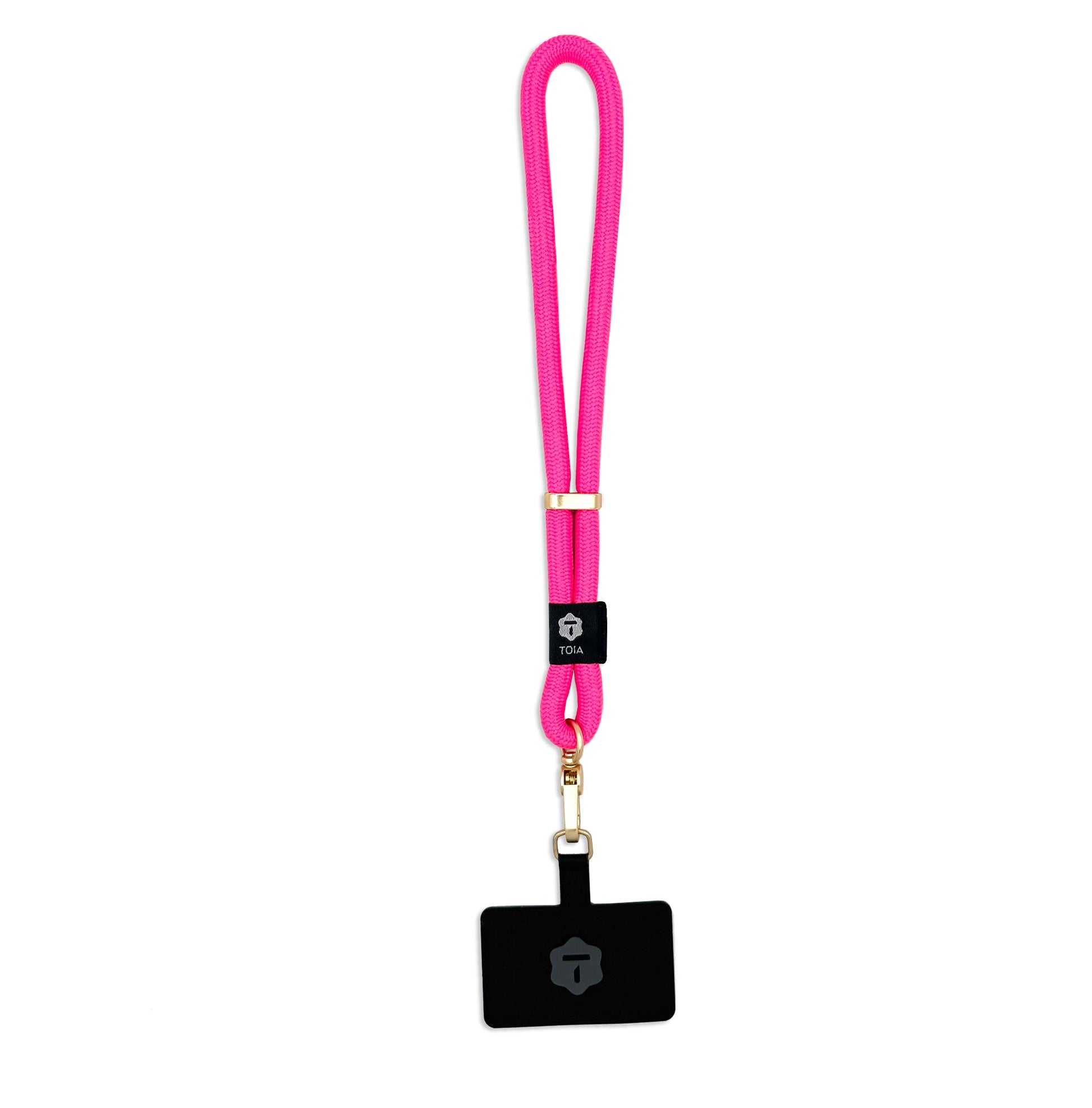 Vibrant hot pink rope wrist phone strap by TOIA with gold hardware